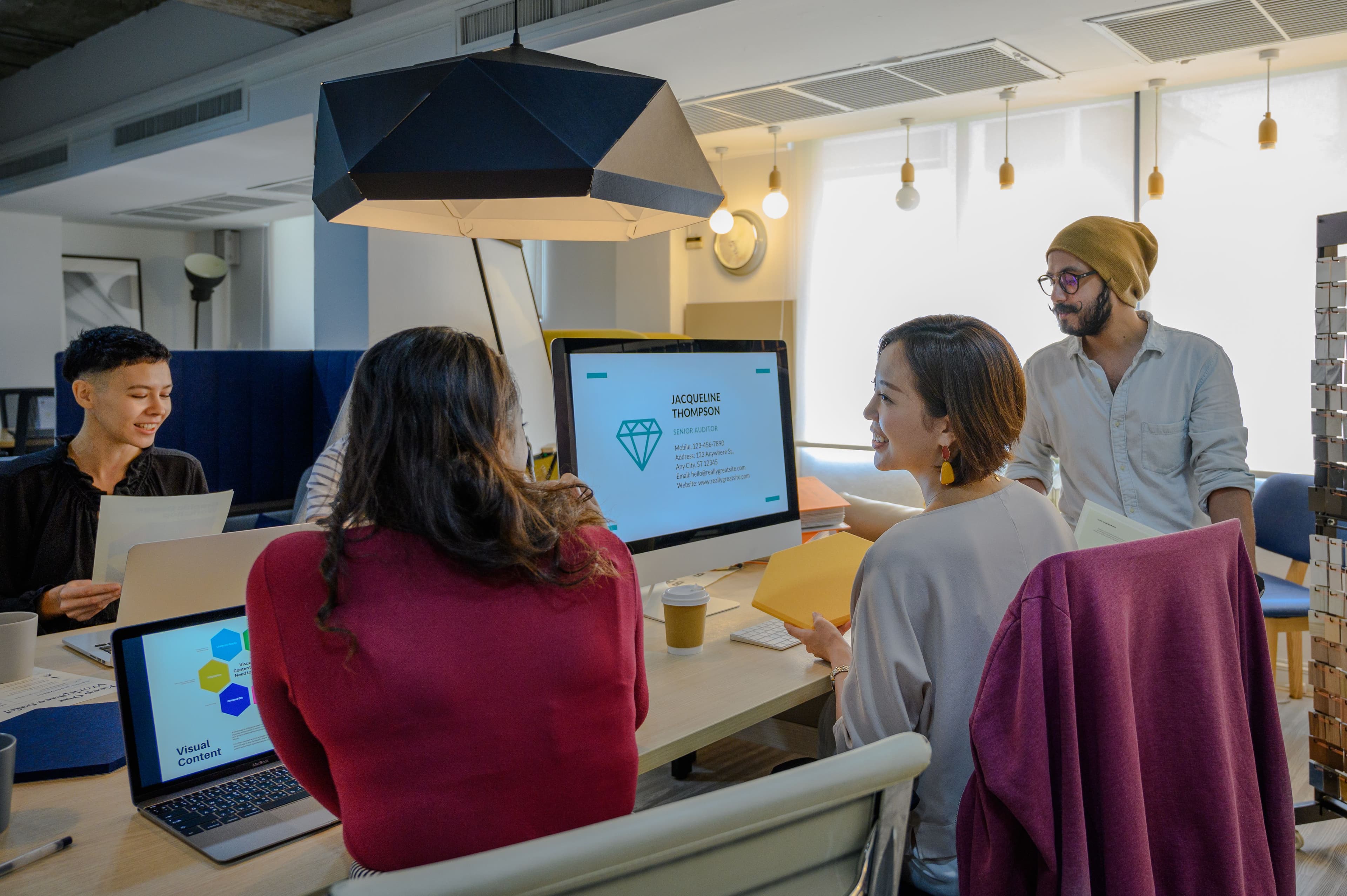 Diverse team engaging in a collaborative office meeting