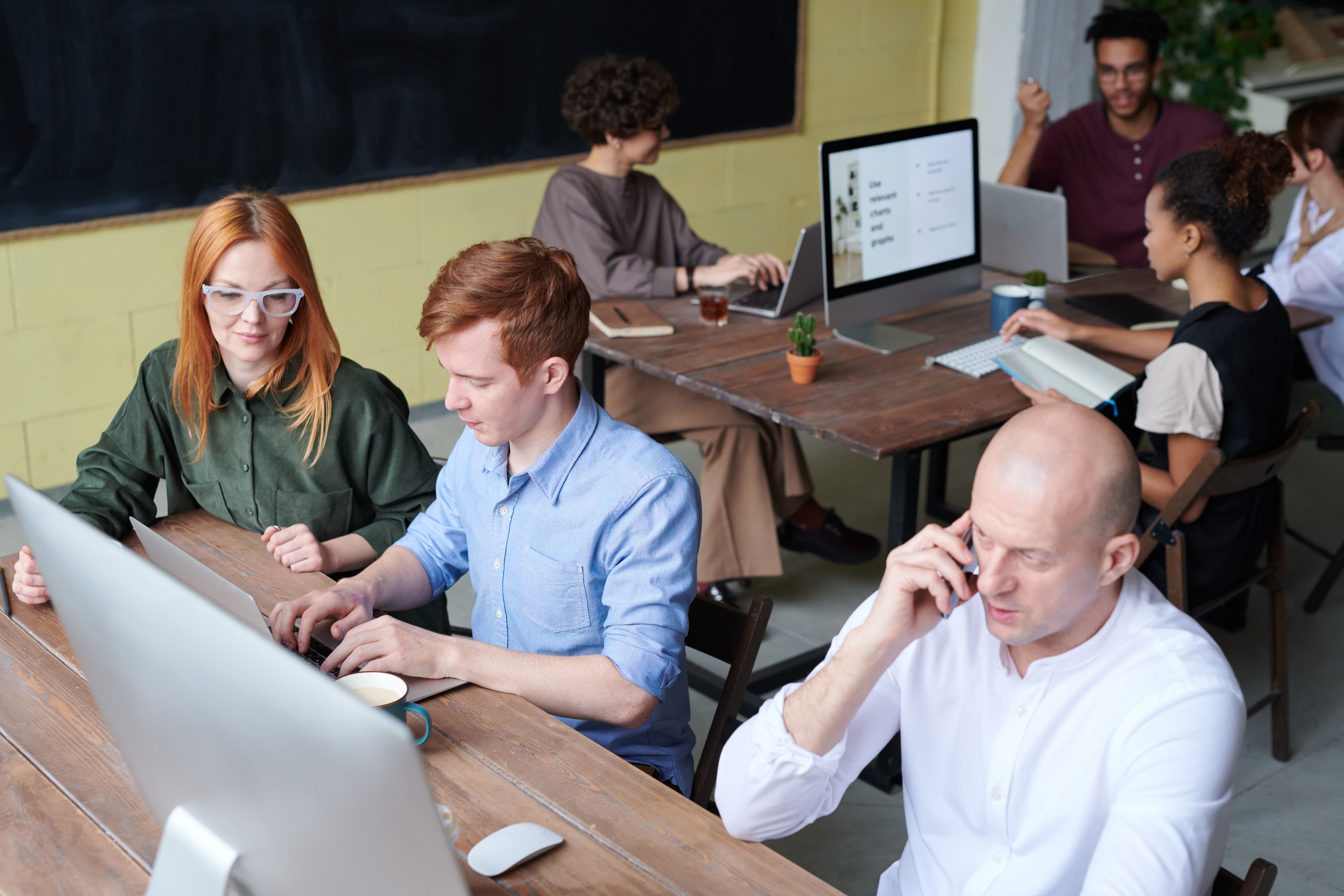 A busy team of professionals collaborating in a modern office space