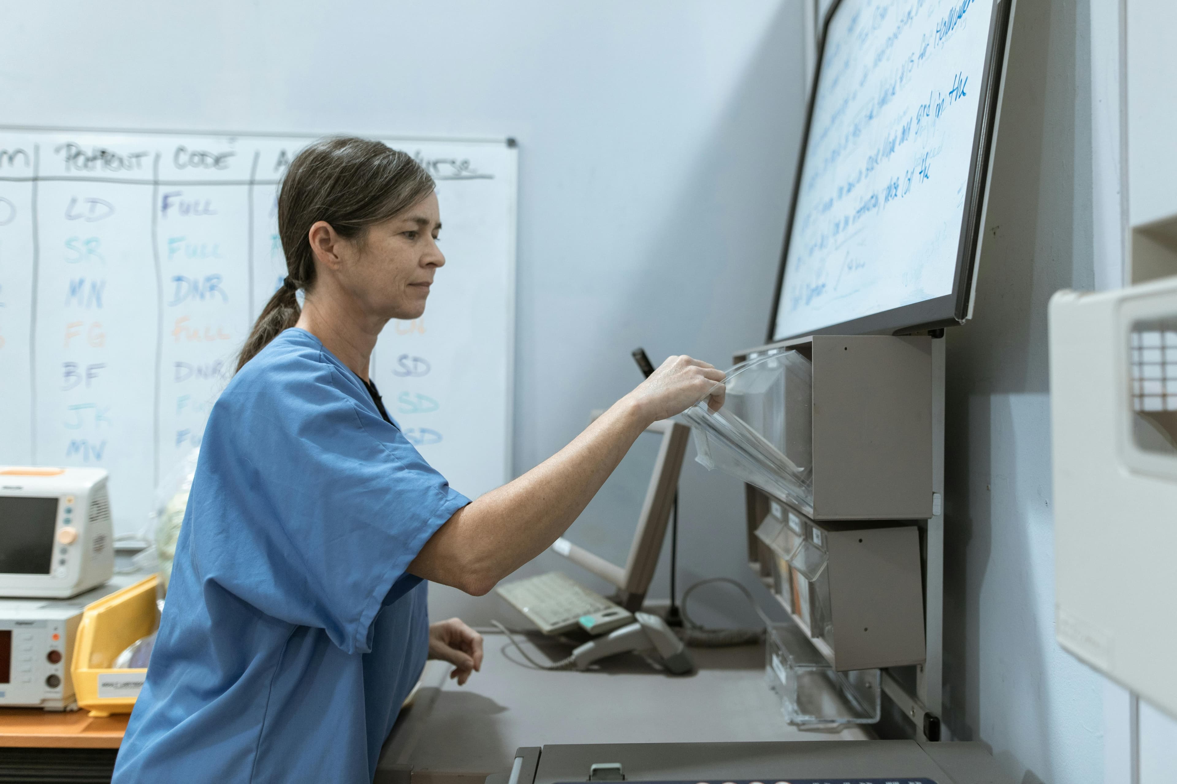 Nurse arranging medical supplies in a healthcare setting